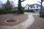 Sweeping sandstone path installed leading to front door, driveway perimeter edged with sandstone setts all hand pointed, Natural sandstone wall constructed with crease tile and 6mm Scottish beach gravel installed to drive