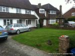 BEFORE: Driveway with old cracked concrete and mainly lawn with overgrown hedge