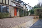 Sweeping sandstone path installed leading to front door, driveway perimeter edged with sandstone setts all hand pointed, Natural sandstone wall constructed with crease tile and 6mm Scottish beach gravel installed to 