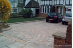 New driveway installed using Marshall's Tegula paving with contrasting charcoal border