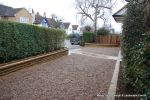 Sweeping sandstone path installed leading to front door, driveway perimeter edged with sandstone setts all hand pointed, Natural sandstone wall constructed with crease tile and 6mm Scottish beach gravel installed to 