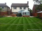 Tired garden received a complete new design Patio installed with 4 size sawn sandstone paving edged with firestone rocks and alpine planting, steps built with sawn sandstone uprights and sawn sandstone bullnose treads, New lawn installed in 3 rings all ed