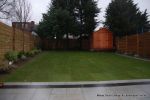 New Granite patio and path installed with contrasting dark colour band, New lawn, fencing and planting installed