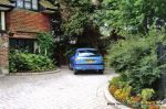 Sweeping curved driveway installed with Marshall's Tegula paving and Kerbs