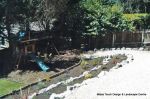 AFTER: Access to children's play area built via a steep slope with Irish rockery, decorative gravel and sleepers ready for planting