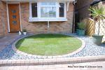 AFTER: Driveway installed with Tegula paving with added jumper block, kerbs installed to retain split levels and feature circle lawn and fencing installed. 