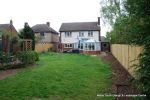 BEFORE: The patio was poorly built and to small and the lawn and beds were drab and tired looking