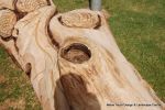 After: This mighty oak trunk is given a new lease of life with a beautifully carving of a woodland wildlife scene including butterflies, beetles oak leafs and acorns for the children of the nursery to enjoy for many generations to come. 