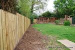 BEFORE: The patio was poorly built and to small and the lawn and beds were drab and tired looking