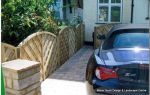 New driveway installed using Marshall's Tegula paving with contrasting charcoal border