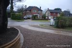 Sweeping sandstone path installed leading to front door, driveway perimeter edged with sandstone setts all hand pointed, Natural sandstone wall constructed with crease tile and 6mm Scottish beach gravel installed to 