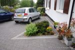 AFTER: New driveway installed using granite paving with contrasting colour band