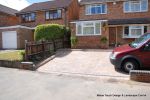 Driveway installed with Tegula paving with added jumper block, kerbs installed to retain split levels and feature circle lawn and fencing installed.