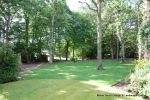 AFTER: Overgrown shrub, laurels and diseased trees were carefully cut back and removed, protected mighty oaks were carefully reduced and thinned with dead wood removed allowing lots more light, Open chainlink fence installed around boundary, ground cleare