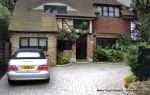 Sweeping curved driveway installed with Marshall's Tegula paving and Kerbs