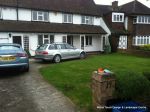 BEFORE: Driveway with old cracked concrete and mainly lawn with overgrown hedge