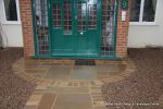 Sweeping sandstone path installed leading to front door, driveway perimeter edged with sandstone setts all hand pointed, Natural sandstone wall constructed with crease tile and 6mm Scottish beach gravel installed to drive