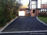 Old tarmac removed original concrete base cleaned and re used with fresh tarmac overlay, Brick slot aco drainage and edgings to create new tarmac drive