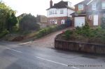 AFTER: Driveway installed with Tegula paving laid at 45 degree to property with in set lighting and feature wall merging into timber wall along front garden and road boundary