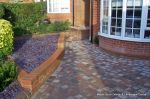 Low brick planter wall with brick on edge to finish