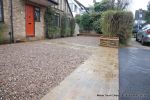 Sweeping sandstone path installed leading to front door, driveway perimeter edged with sandstone setts all hand pointed, Natural sandstone wall constructed with crease tile and 6mm Scottish beach gravel installed to drive