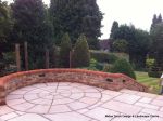 Garden needed a new landscape to match the character of the property a Sweeping ramp was installed with timber curved arbour, tumbled sandstone paving & circle installed and in cased with old stock brickwork capped with double bullnose steps built  with m