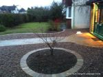 Sweeping sandstone path installed leading to front door, driveway perimeter edged with sandstone setts all hand pointed, Natural sandstone wall constructed with crease tile and 6mm Scottish beach gravel installed to drive