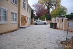 AFTER: Driveway was constructed with tumbled paver's in graphite grey, brick wall and pillars built using matching brick to property   