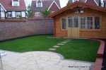 Garden was on a new development new Saxon paving with circle feature installed new lawn, stepping stones and low planter wall summer house with hot tub and lighting installed