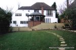 Fresh topsoil and new lawn installed with curved stepping stone path leading to tranquil arbour seating all overgrown shrubs and trees carefully cutback and new feature planting with lighting and irrigation installed