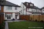 New Granite patio and path installed with contrasting dark colour band, New lawn, fencing and planting installed