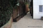 New driveway installed using Marshall's Tegula paving with contrasting charcoal border