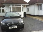 New driveway installed using granite paving with contrasting colour band and inset lights