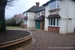 AFTER: Sweeping sandstone path installed leading to front door, driveway perimeter edged with sandstone setts all hand pointed, Natural sandstone wall constructed with crease tile and 6mm Scottish beach gravel installed to drive.