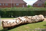 After: This mighty oak trunk is given a new lease of life with a beautifully carving of a woodland wildlife scene including butterflies, beetles oak leafs and acorns for the children of the nursery to enjoy for many generations to come. 