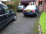 BEFORE: Tired and patchy old tarmac driveway