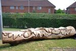 After: This mighty oak trunk is given a new lease of life with a beautifully carving of a woodland wildlife scene including butterflies, beetles oak leafs and acorns for the children of the nursery to enjoy for many generations to come. 