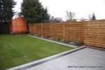 AFTER: New Granite patio and path installed with contrasting dark coulour band, New lawn, fencing and planting installed