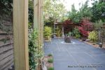 Town house garden paved with black limestone 