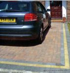 Driveway installed with Marshalls Driveline 50 in brindle with buff & charcoal contrast bands and mitred corners