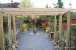 Town house garden paved with black limestone 